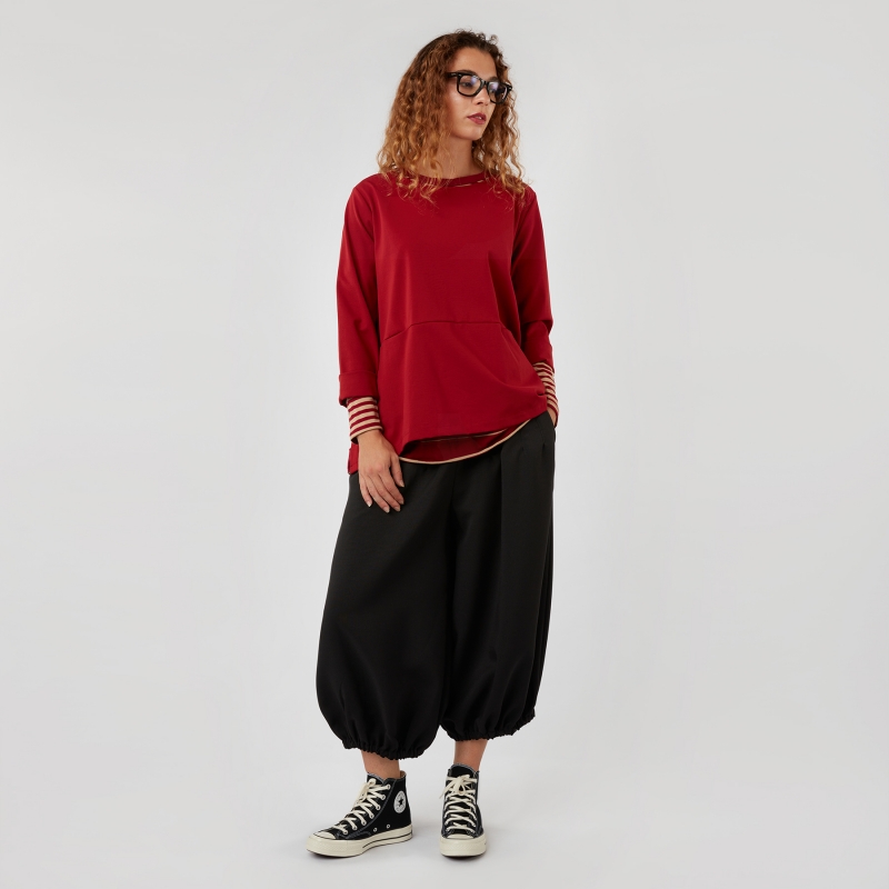 TROUSERS WITH ROUNDED ANKLES
