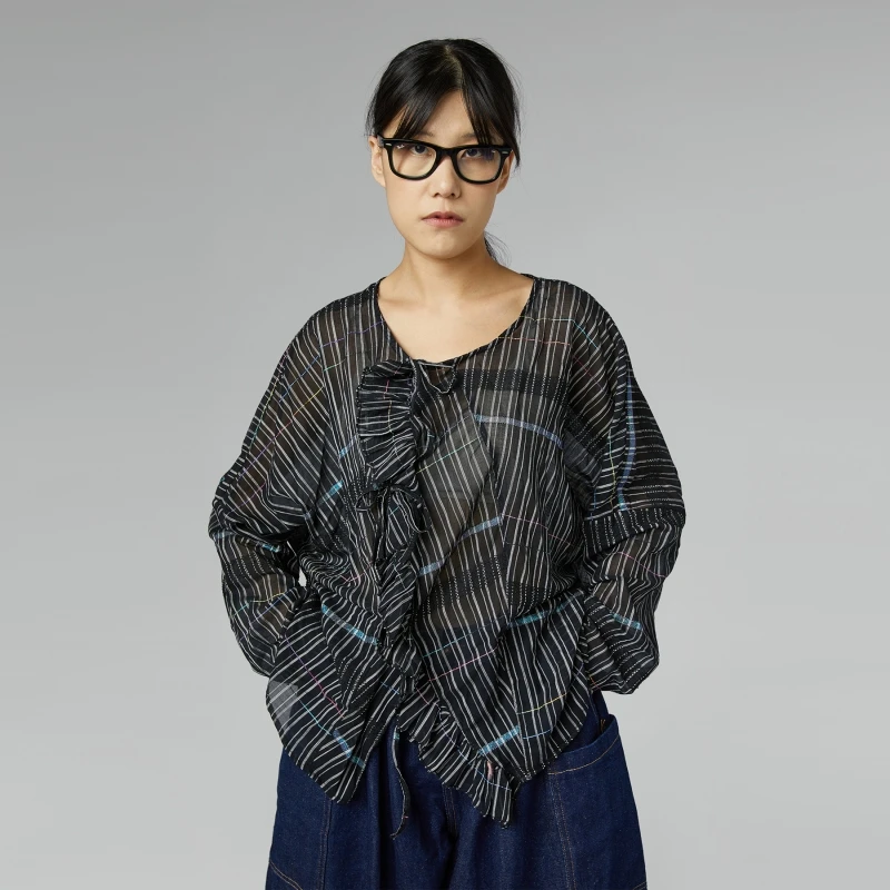 BLUSA SEMITRASPARENTE CON...