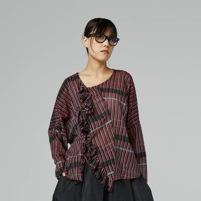 BLUSA SEMITRASPARENTE CON...
