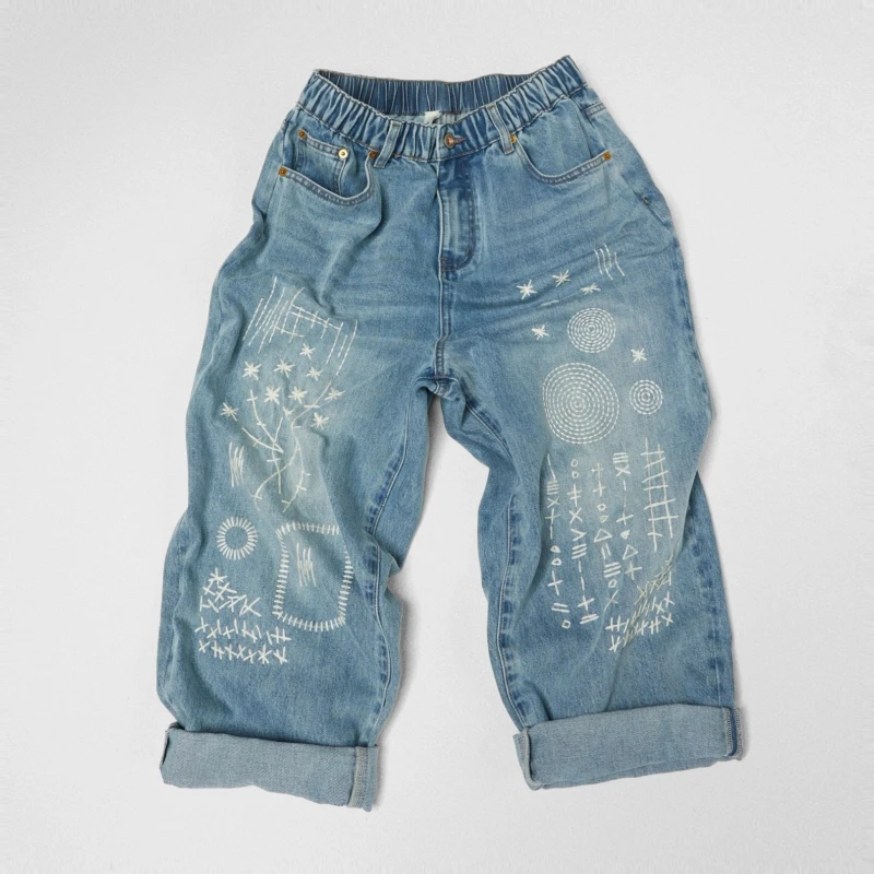 JEANS WITH GEOMETRIC...