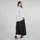 PANTALON AVEC PARÉO À EFFET JUPE SUR LE DEVANT