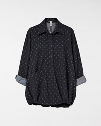 BLUSA CON APERTURA SUL RETRO