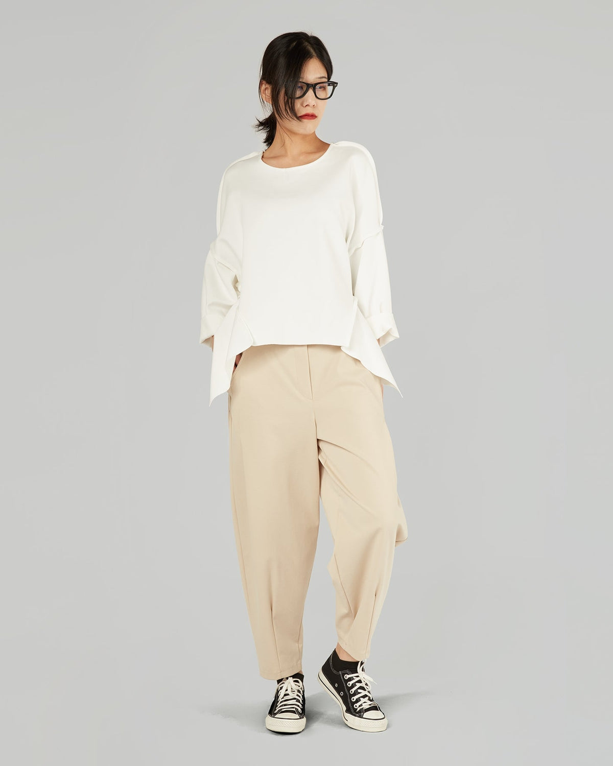 CARROT FIT TROUSERS IN MILAN STITCH FABRIC