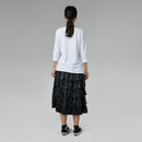 BLACK RUFFLED SKIRT IN FAUX LEATHER FABRIC