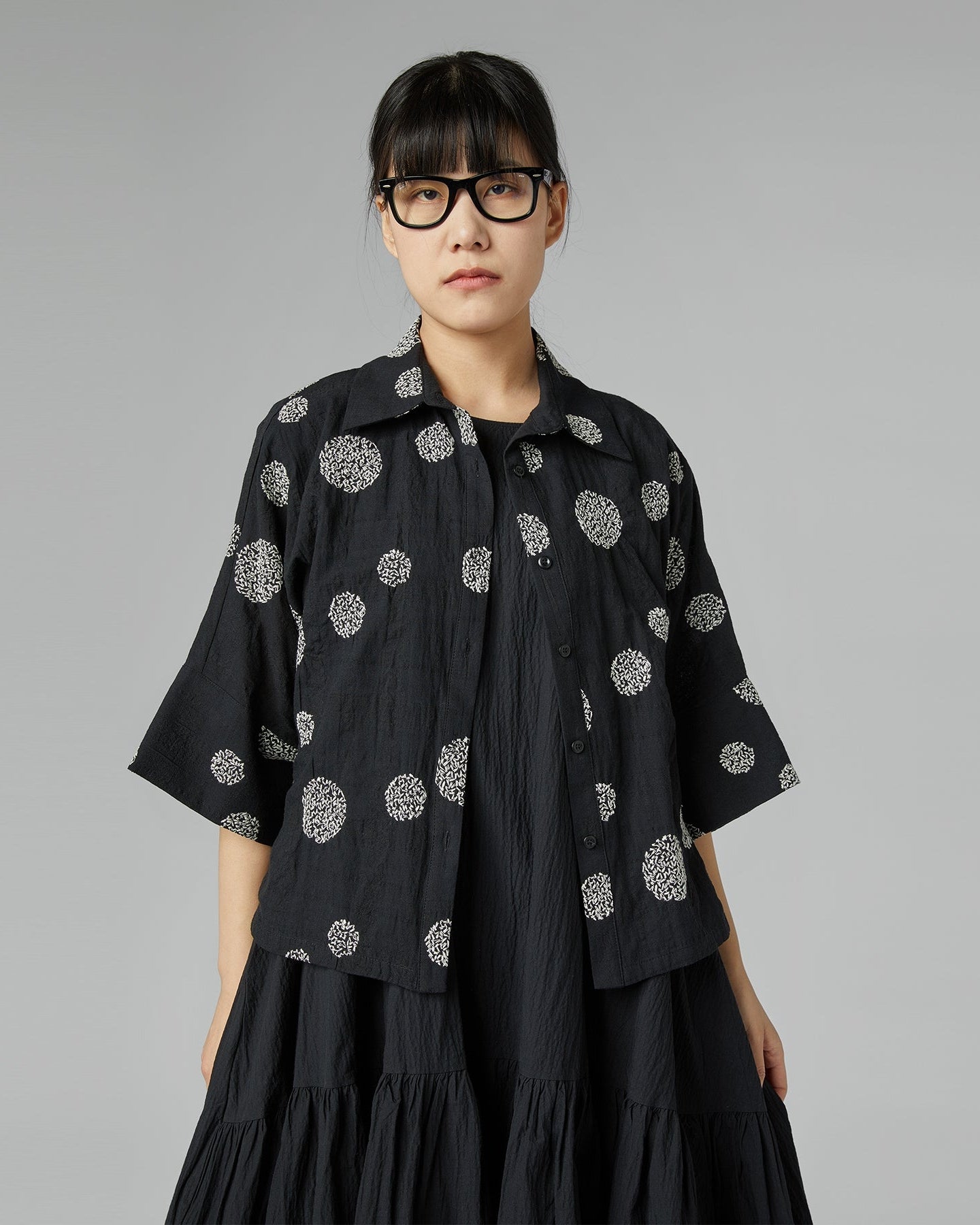 BLACK SHIRT WITH EMBOSSED DESIGN