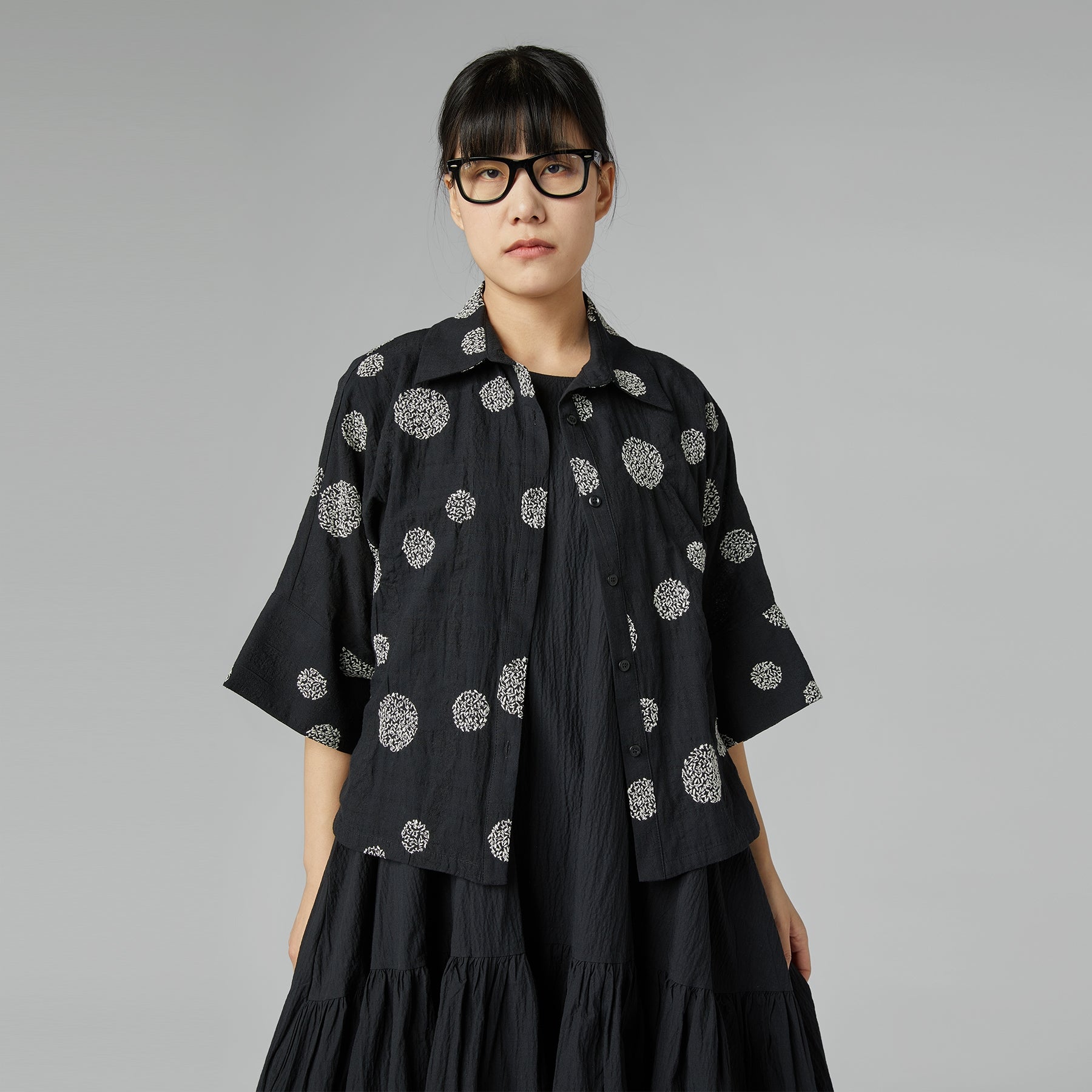 BLACK SHIRT WITH EMBOSSED DESIGN