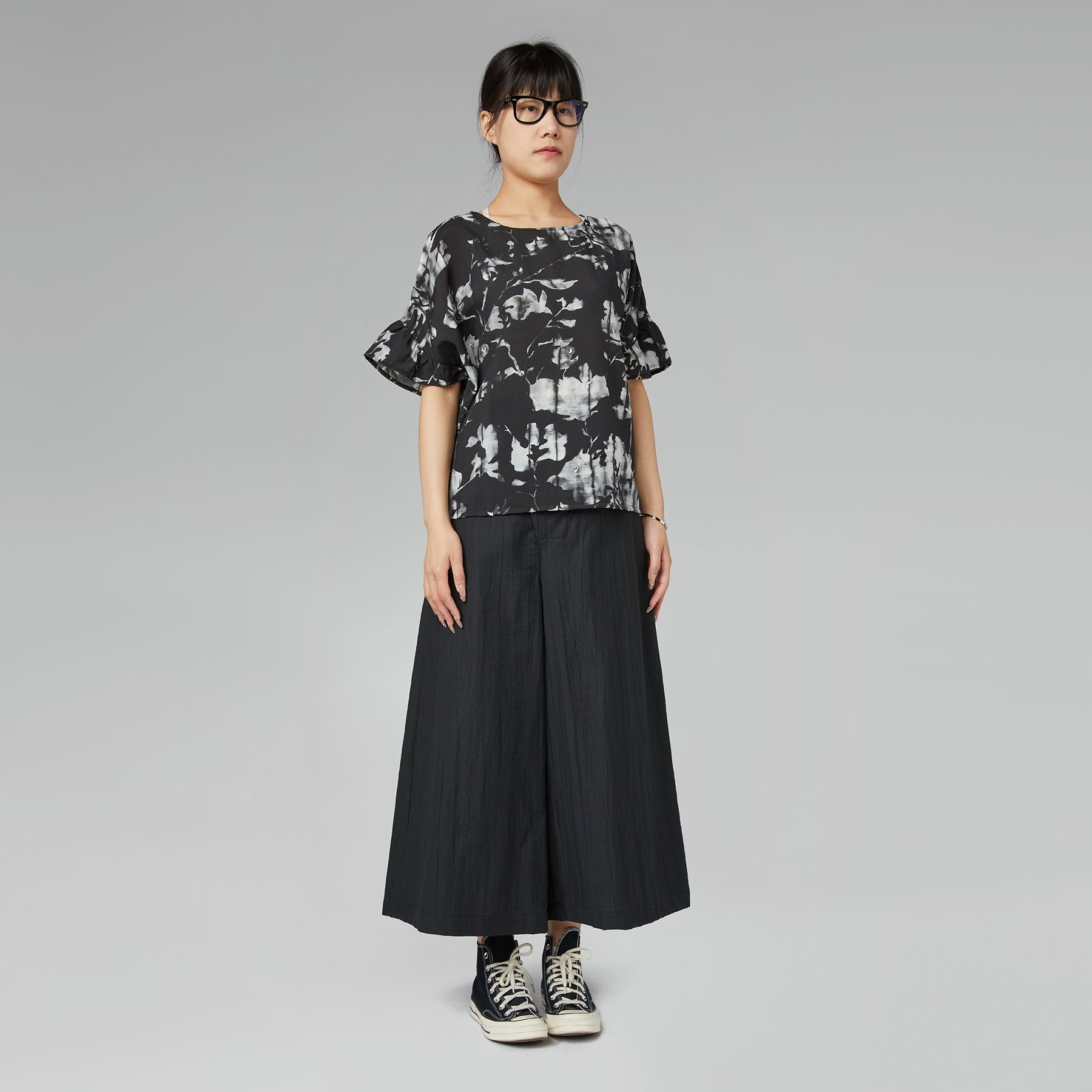 TROUSERS WITH OFF-CENTER BUCKLE MUD