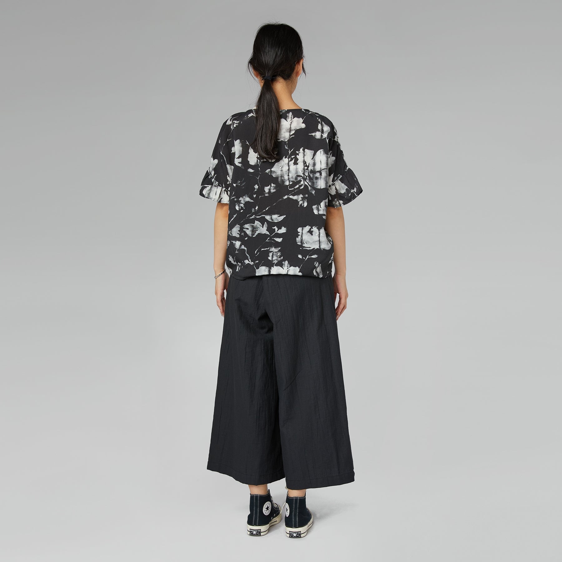 TROUSERS WITH OFF-CENTER BUCKLE MUD