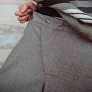 TROUSERS WITH OFF-CENTER BUCKLE MUD
