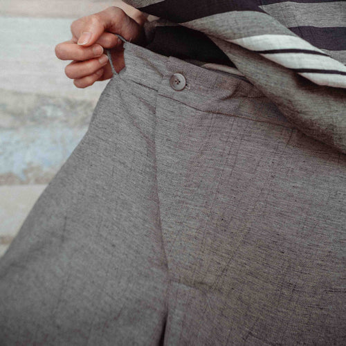 TROUSERS WITH OFF-CENTER BUCKLE MUD