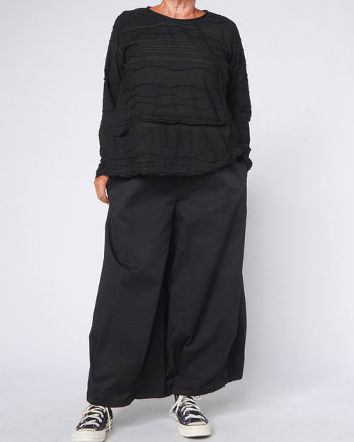 BLUSE MIT WELLENSTRUKTUR