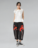 JEANS NEGROS CON BORDADO DE FLORES